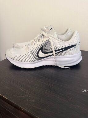 Nike White Running Shoes with Black Swoosh